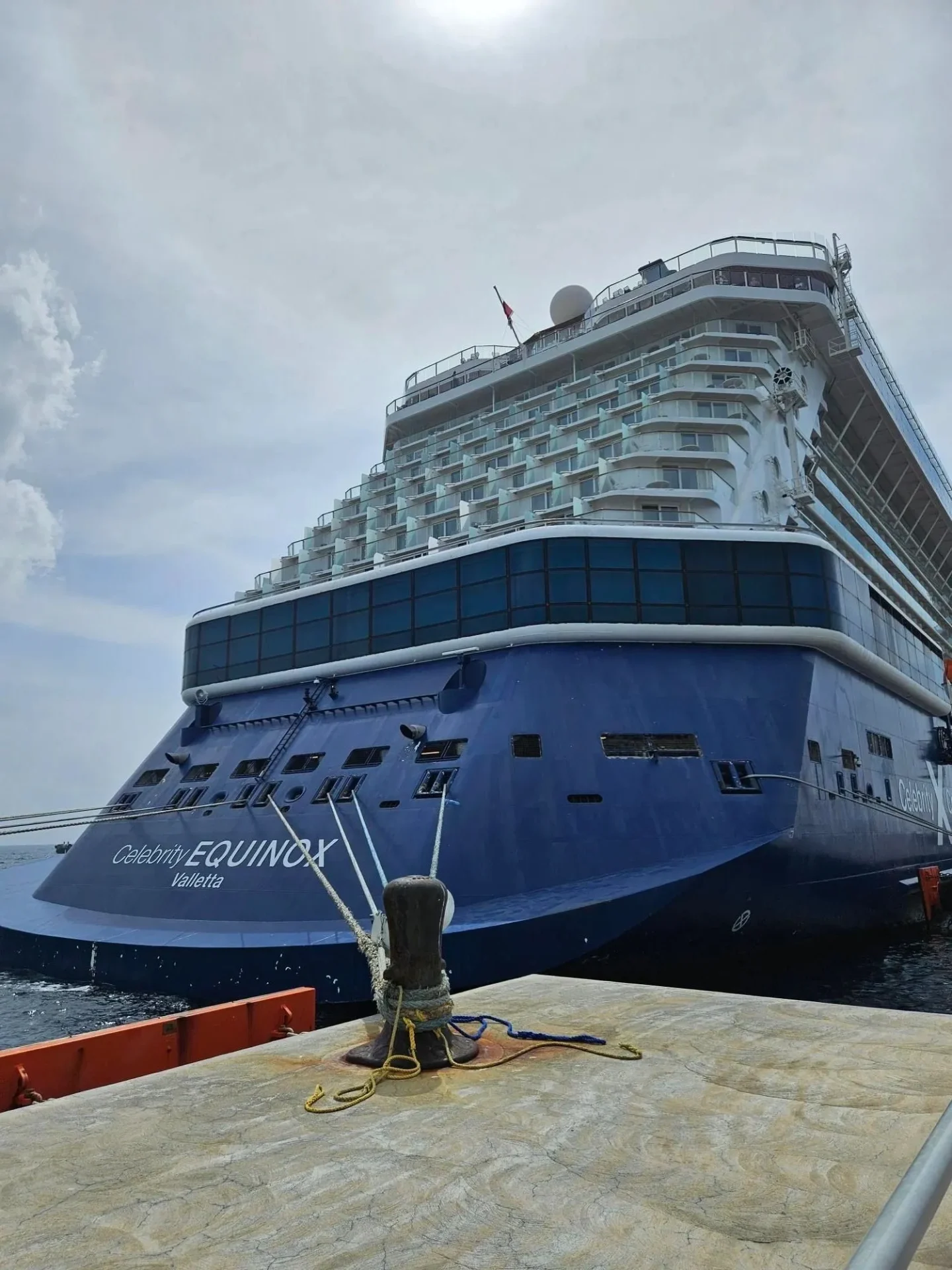 A large cruise ship docked at the pier.