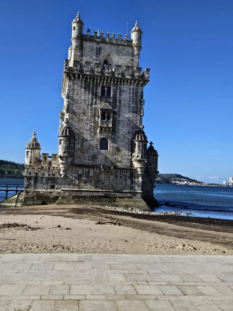 Stone tower on a sandy beach.