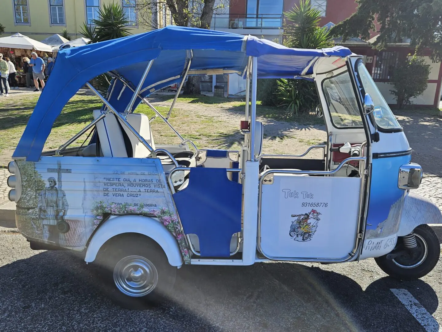 Blue and white Tuk Tuk with a passenger seat.