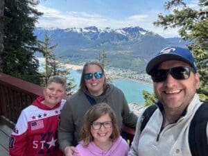 Tropical beach with palm trees and blue sky.