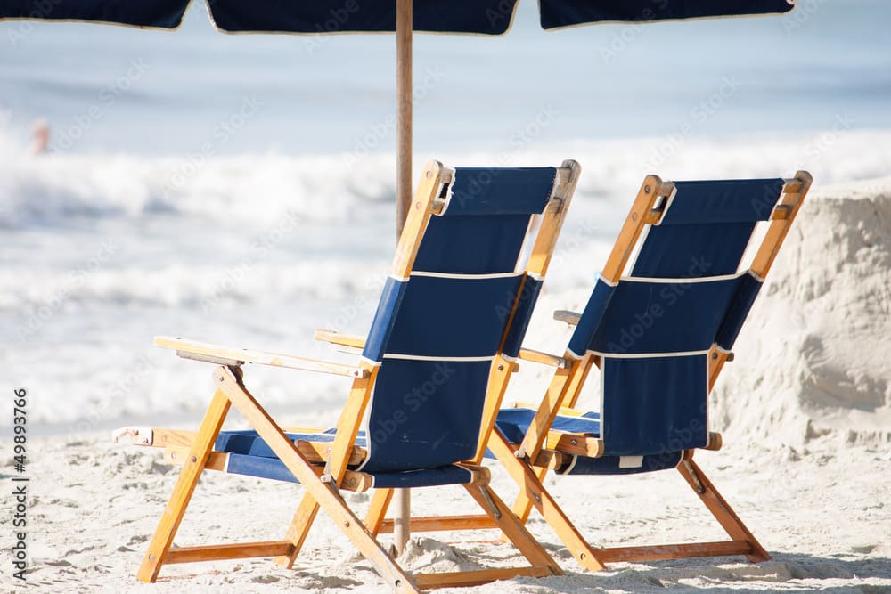 Tropical beach with palm trees and sunset.